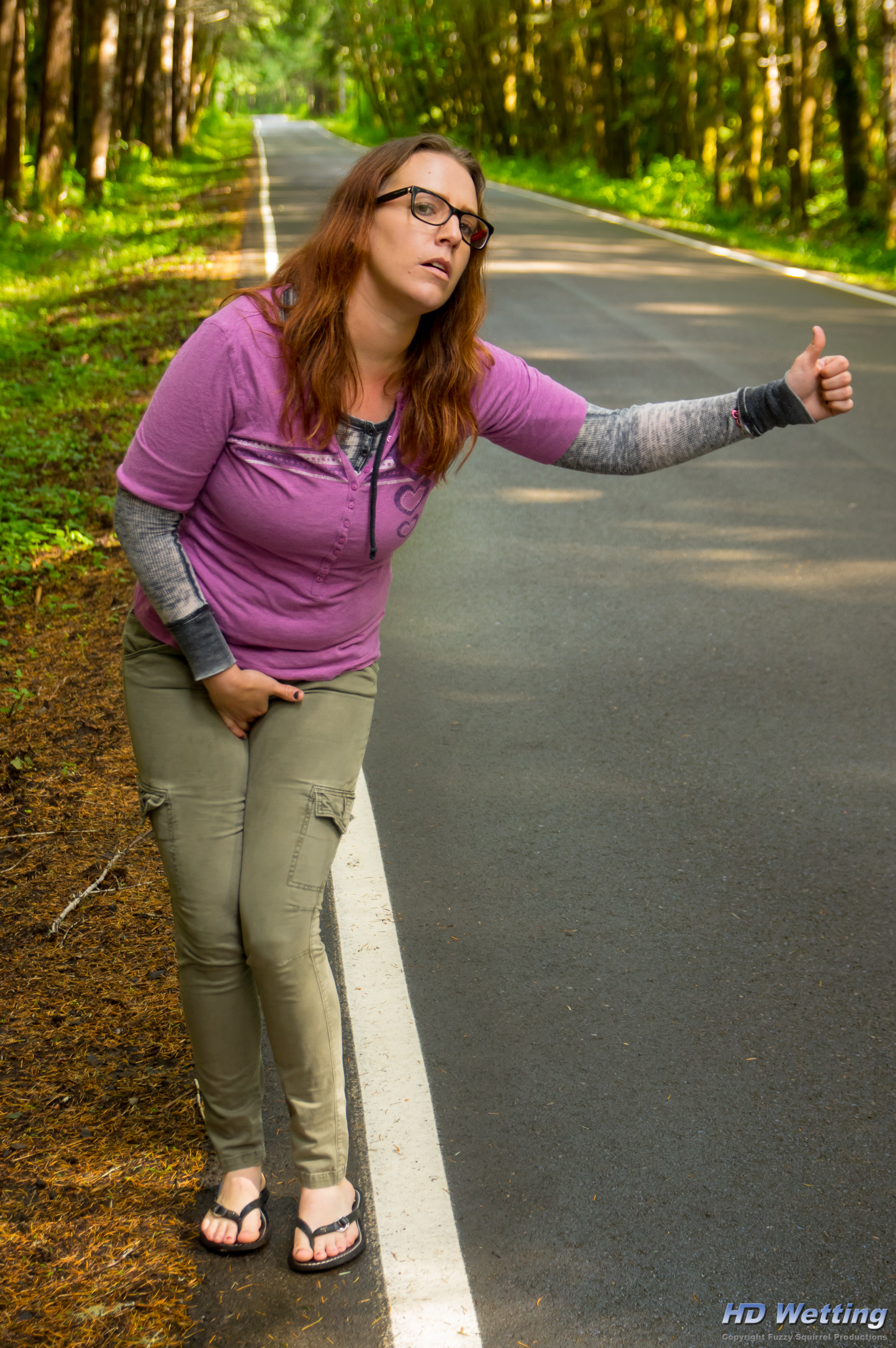 hitchhiking-3050 While hitchhiking Alisha is so desperate she has to hold herself to stop from peeing in her pants