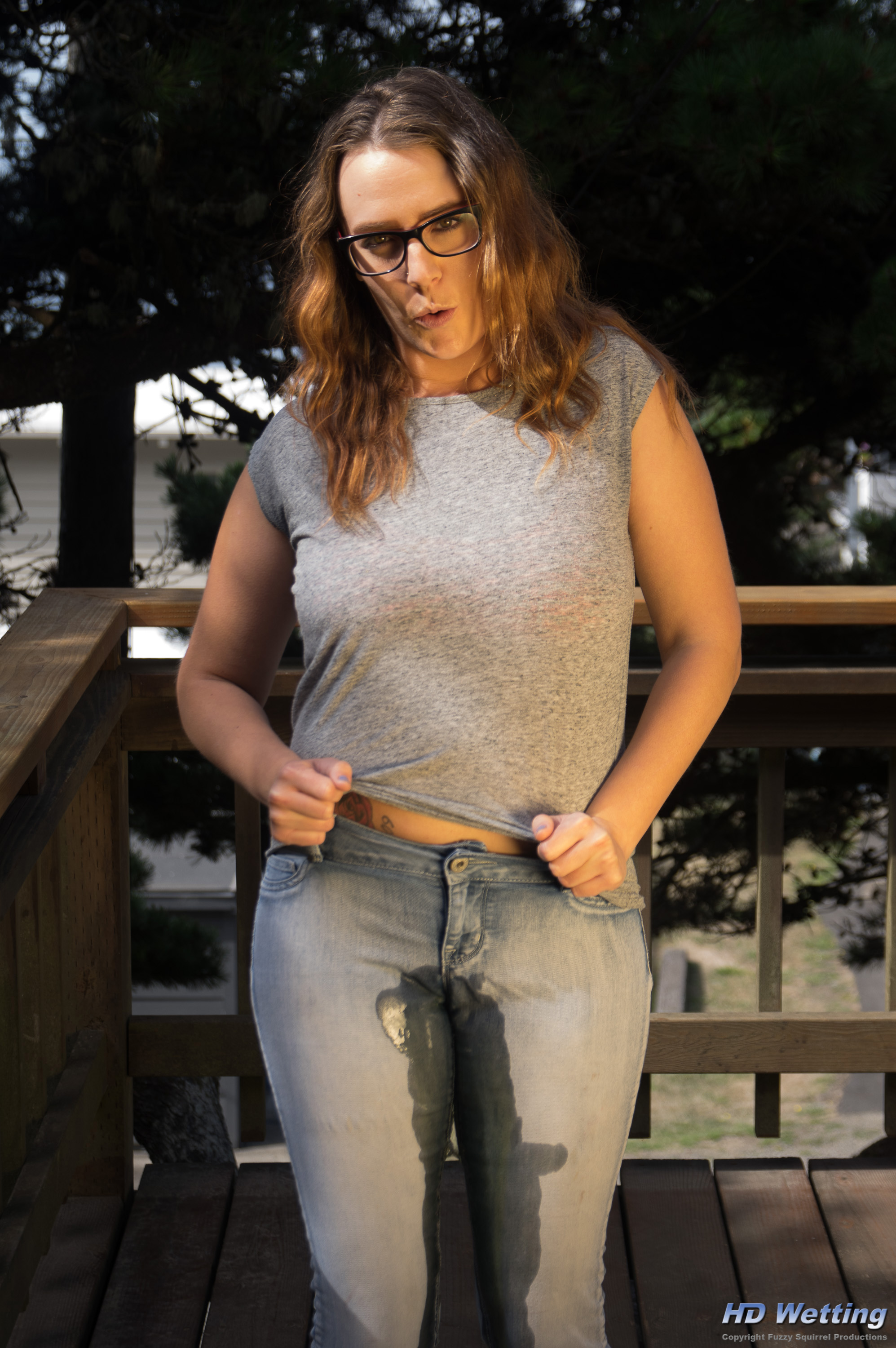 jeans-panties-3935 Her jeans glisten with wetness as she pees in her pants