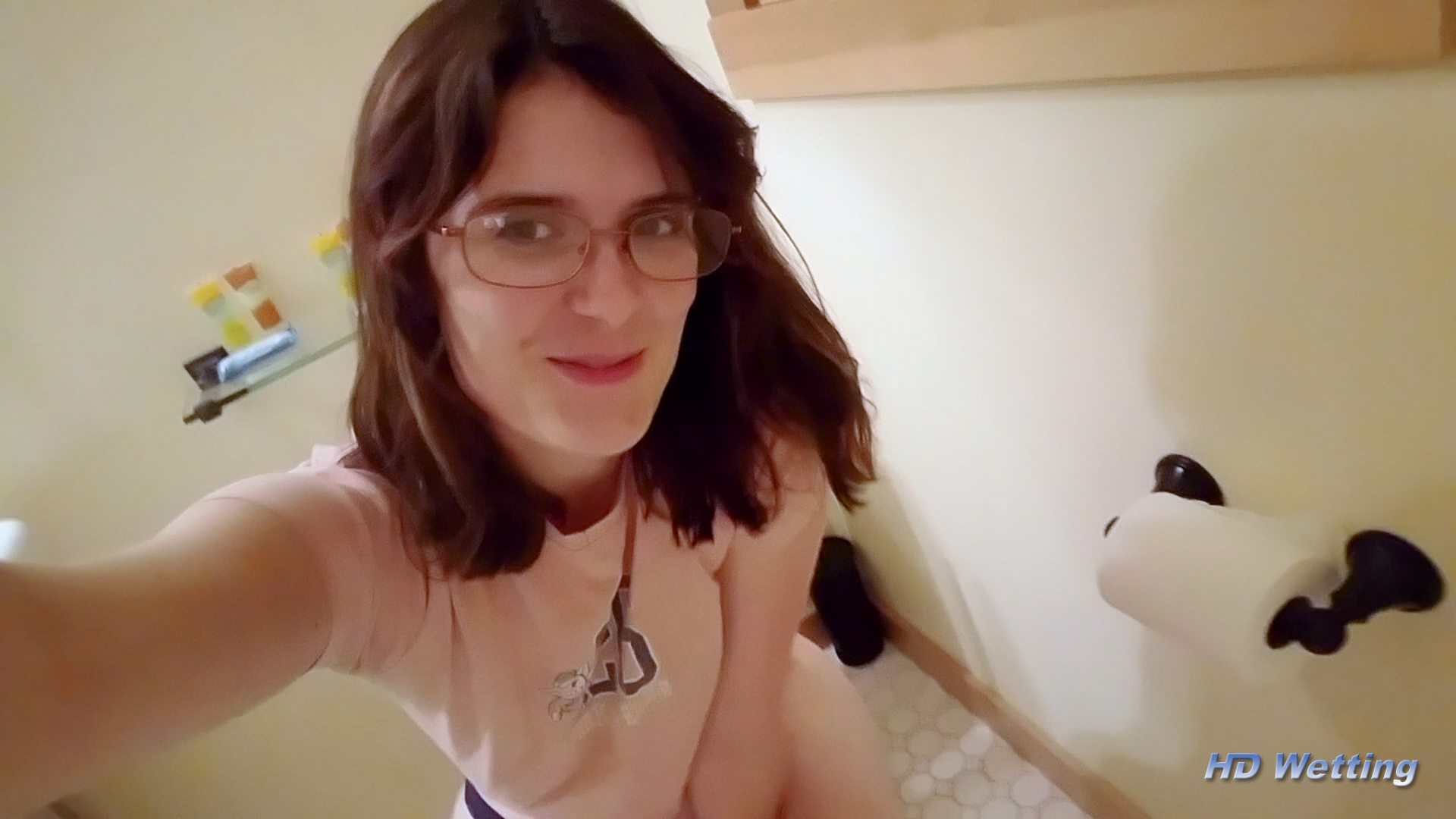 toilet-1 Sosha gives us a naughty smile as she sits on the toilet, preparing to pee in her panties