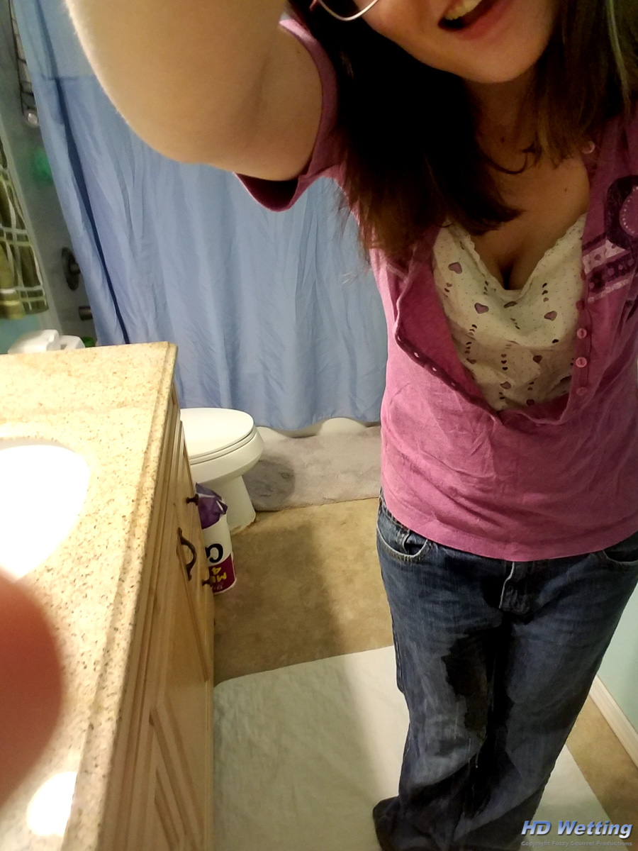 bathroom-171818 A wet stain is visible on Sosha's jeans as she starts to pee herself