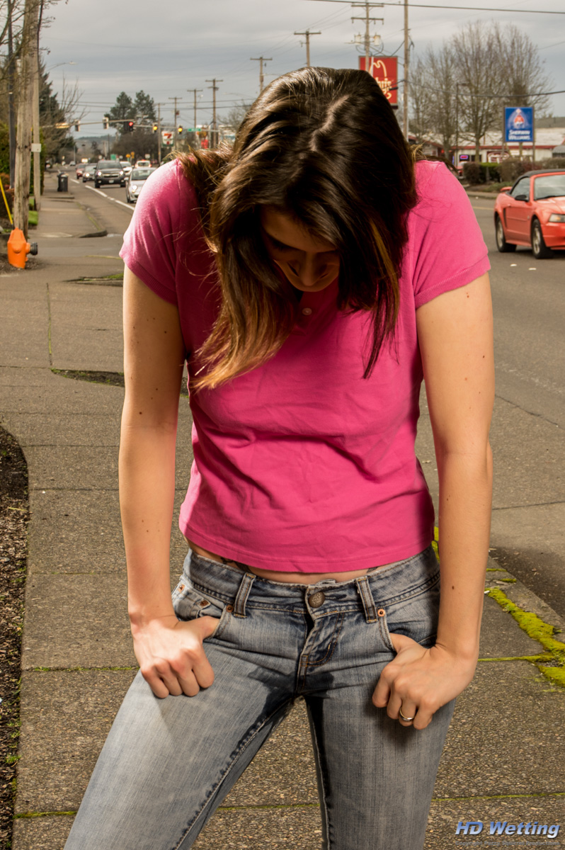 jeans-5564 Sosha looks down as she starts to pee in her jeans