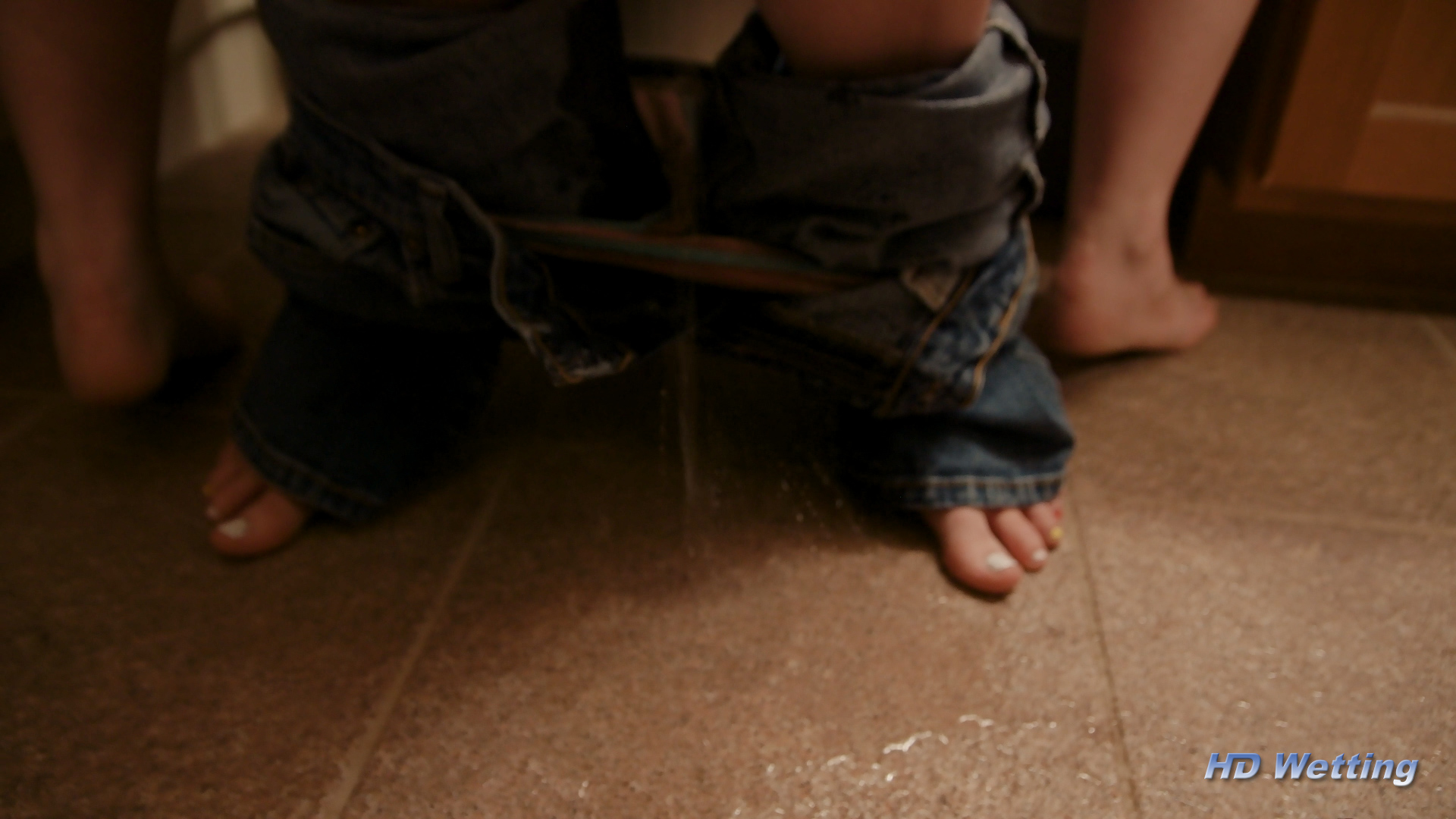 lesbians-5 Lyra's pee stream splatters all over the floor around Sosha's feet