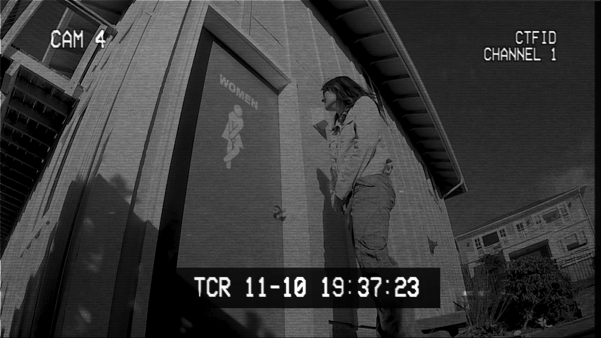 cam-4 Desperately Sosha paces outside the door to the public bathroom, hoping that it is simply occupied.
