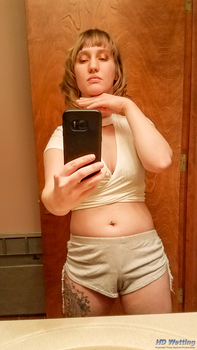 lyra-163530 Lyra poses for a selfie in the bathroom