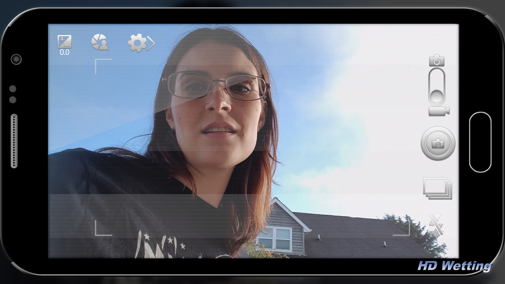 break-1 Sosha records herself on her phone during a break in shooting.