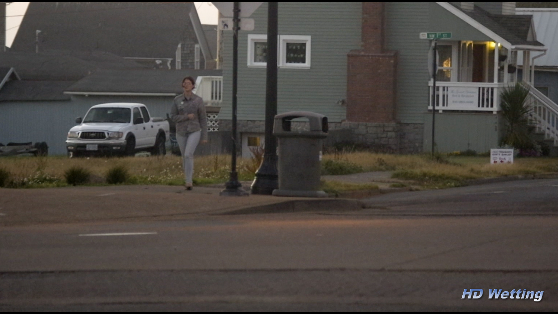 small-1 Sosha walks along a downtown street.