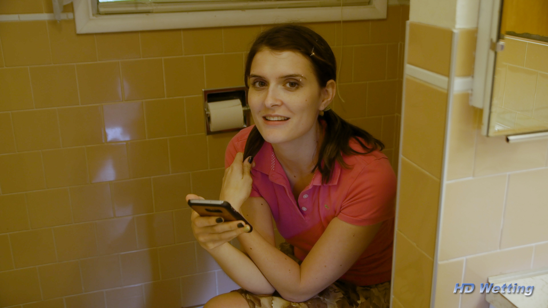 camera-1 Sosha hides in the bathroom, remotely controlling the door locks on her phone