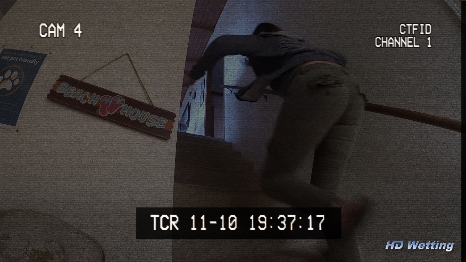 camera-6 Security camera view as Alisha runs upstairs, in dire need of the toilet