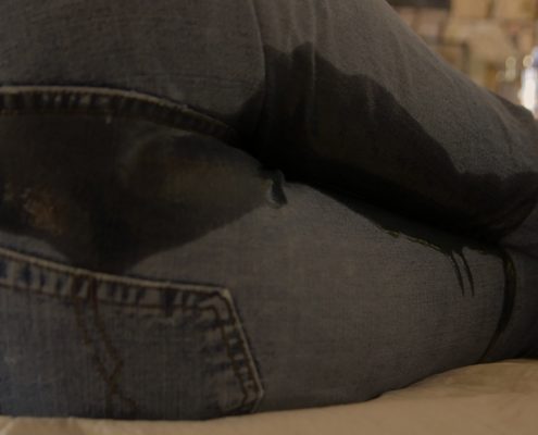 Laying on the floor laughing, Sosha pees in her pants