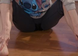 Sitting on the floor, Sosha pees in her pants.