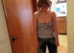 Lyra looks down in shame after wetting her pants.