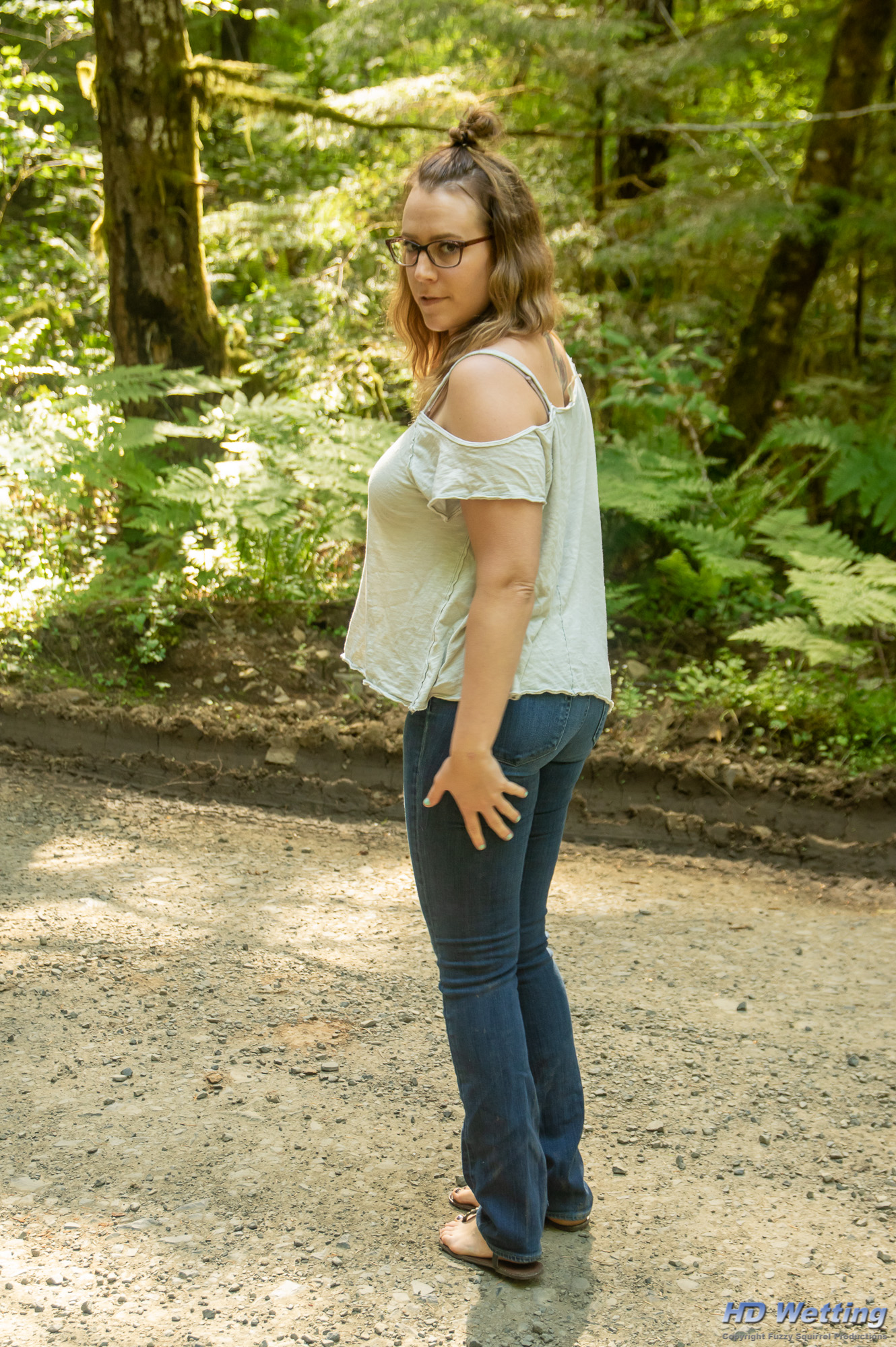jeans-closeup-7403 Wearing a light colored top and very tight jeans, Alisha poses for our camera in the forest.