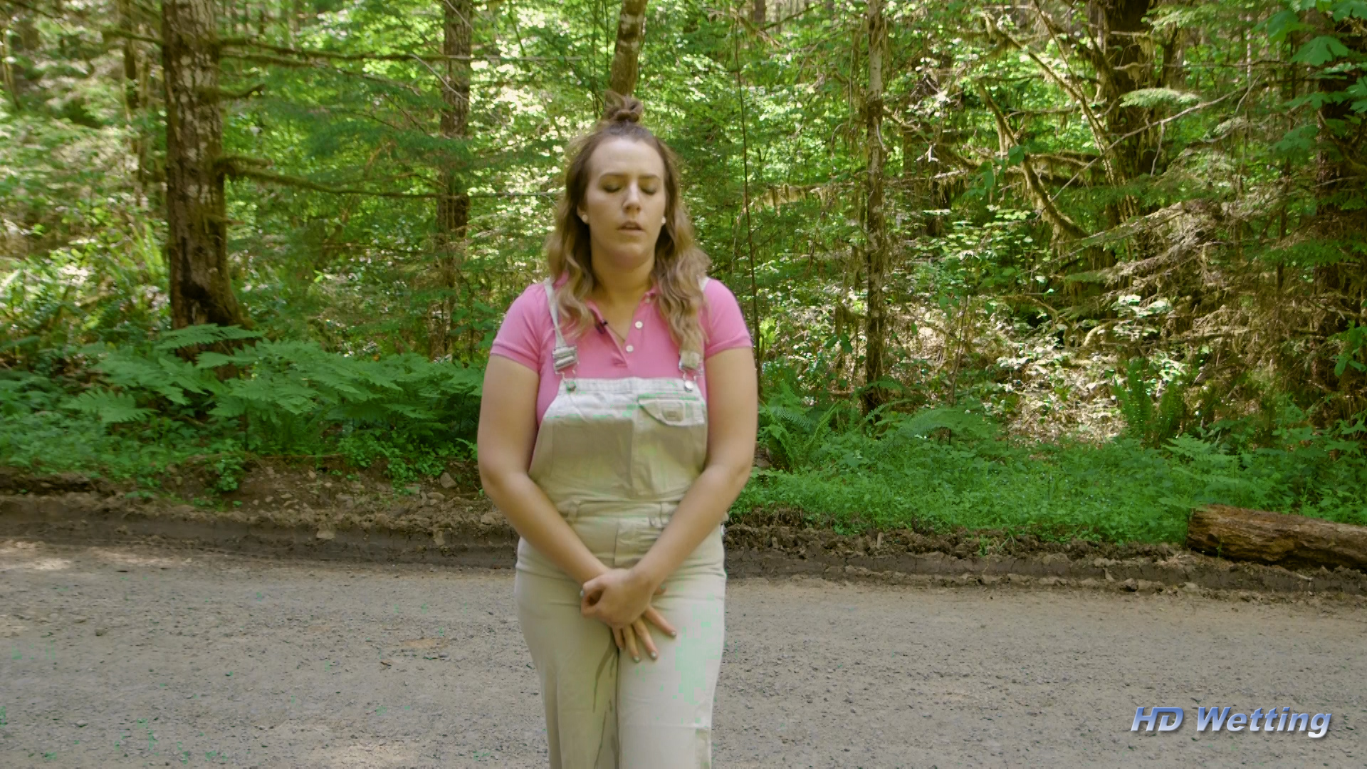 instruction-2 Desperate to pee, Alisha starts to leak in her overalls.