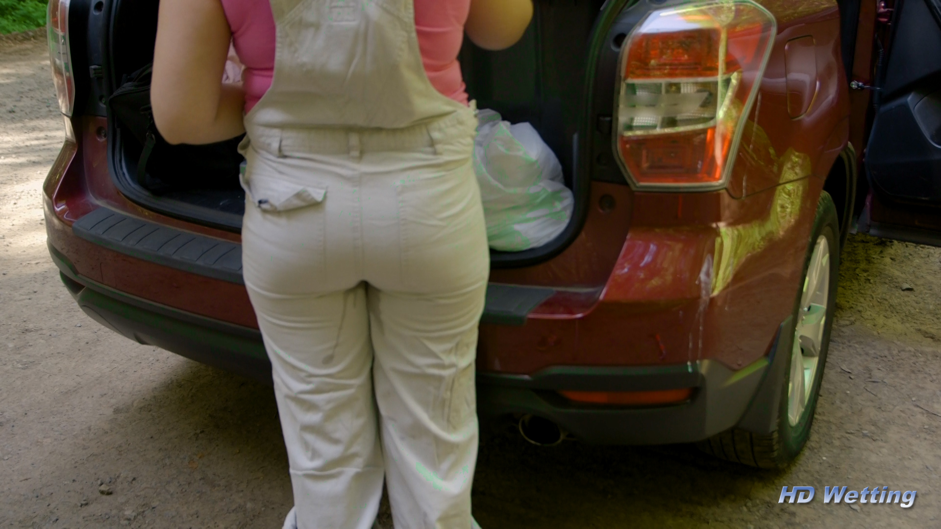 instruction-3 A small wet spot is visible from behind as Alisha tries not to fully pee herself.