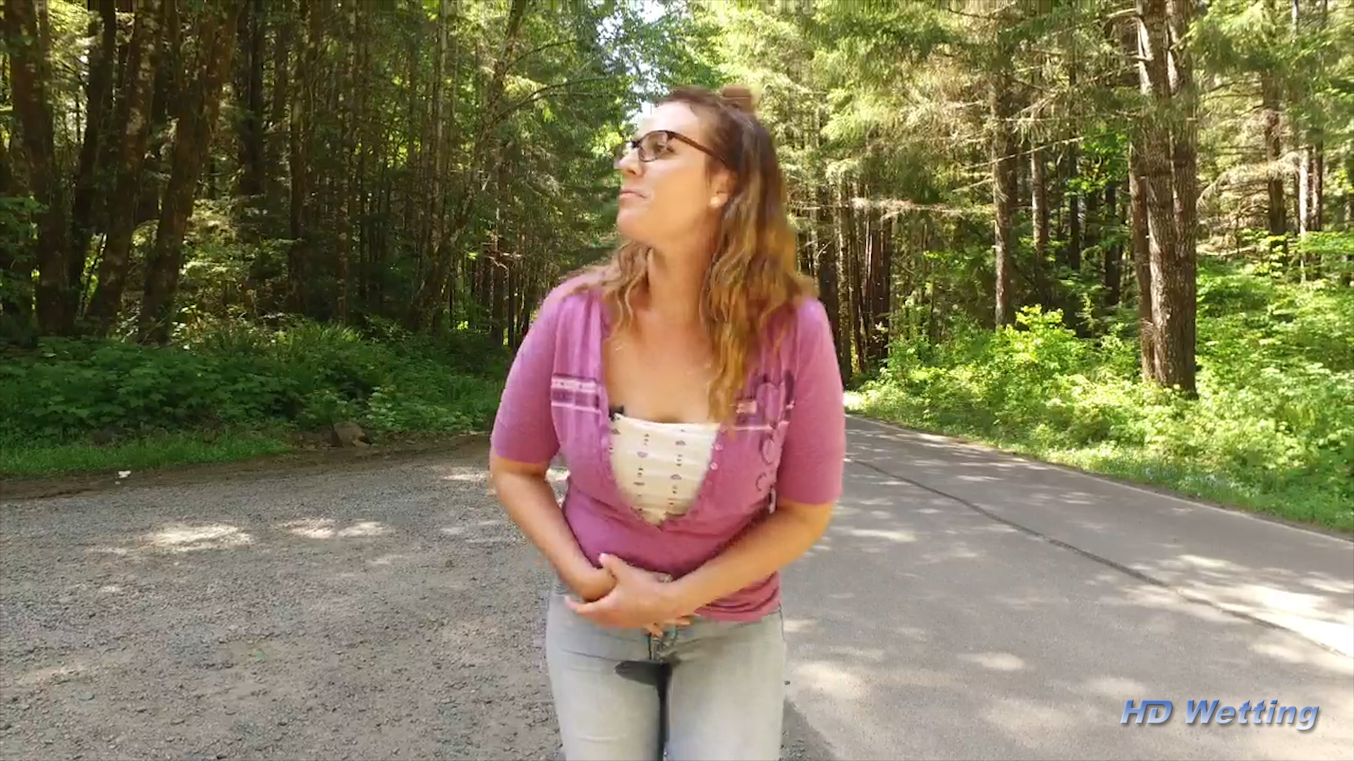street-5 With a visible wet patch on her jeans, Alisha bends over and tries to hold back the flood from making things worse.