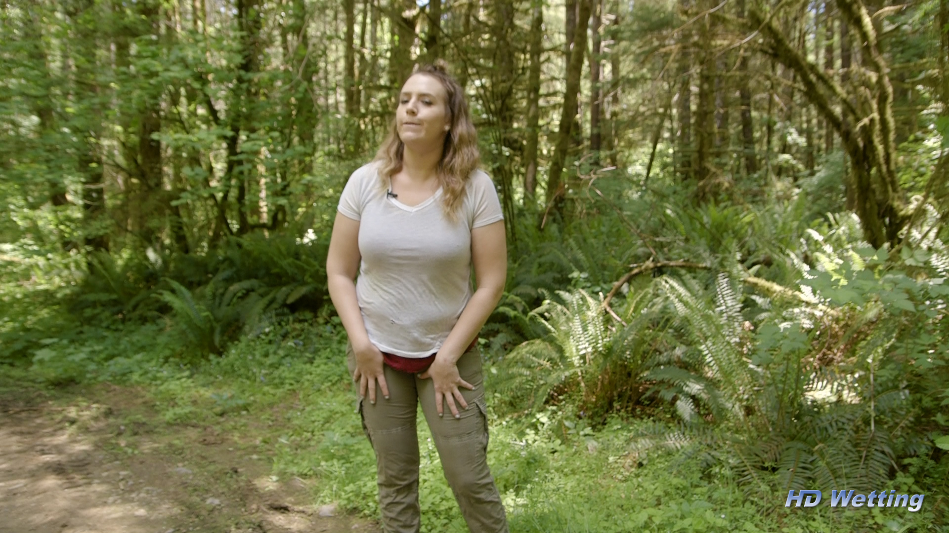 oncam-1 Alisha standing outside in the forest.