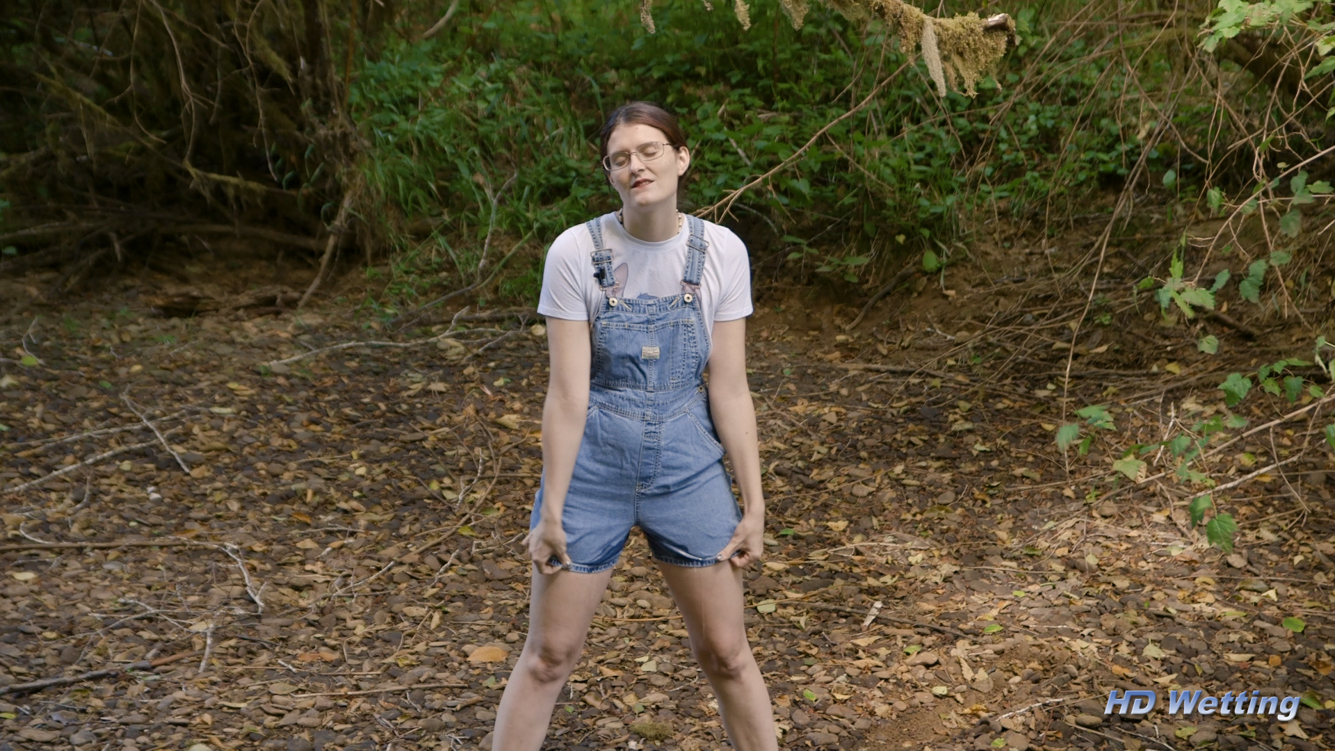 creek-5 Standing next to the creek and peeing in her overalls.