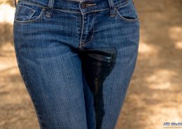 Close up of Sosha peeing in her jeans.