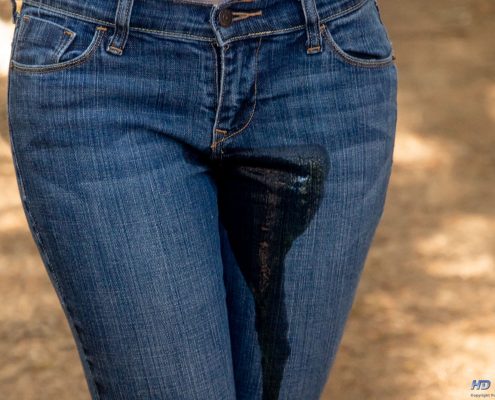 Close up of Sosha peeing in her jeans.