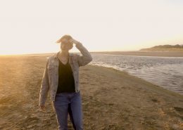 Sosha pees in her jeans while walking on the beach.