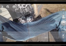 A close up of Sosha wearing the jeans she just peed in.