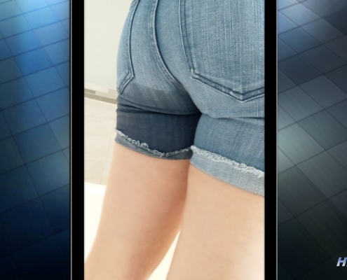 Rear view of Alisha's wet denim shorts.