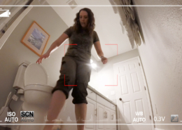 Drops are visible falling from Alisha's pants just in front of the toilet.