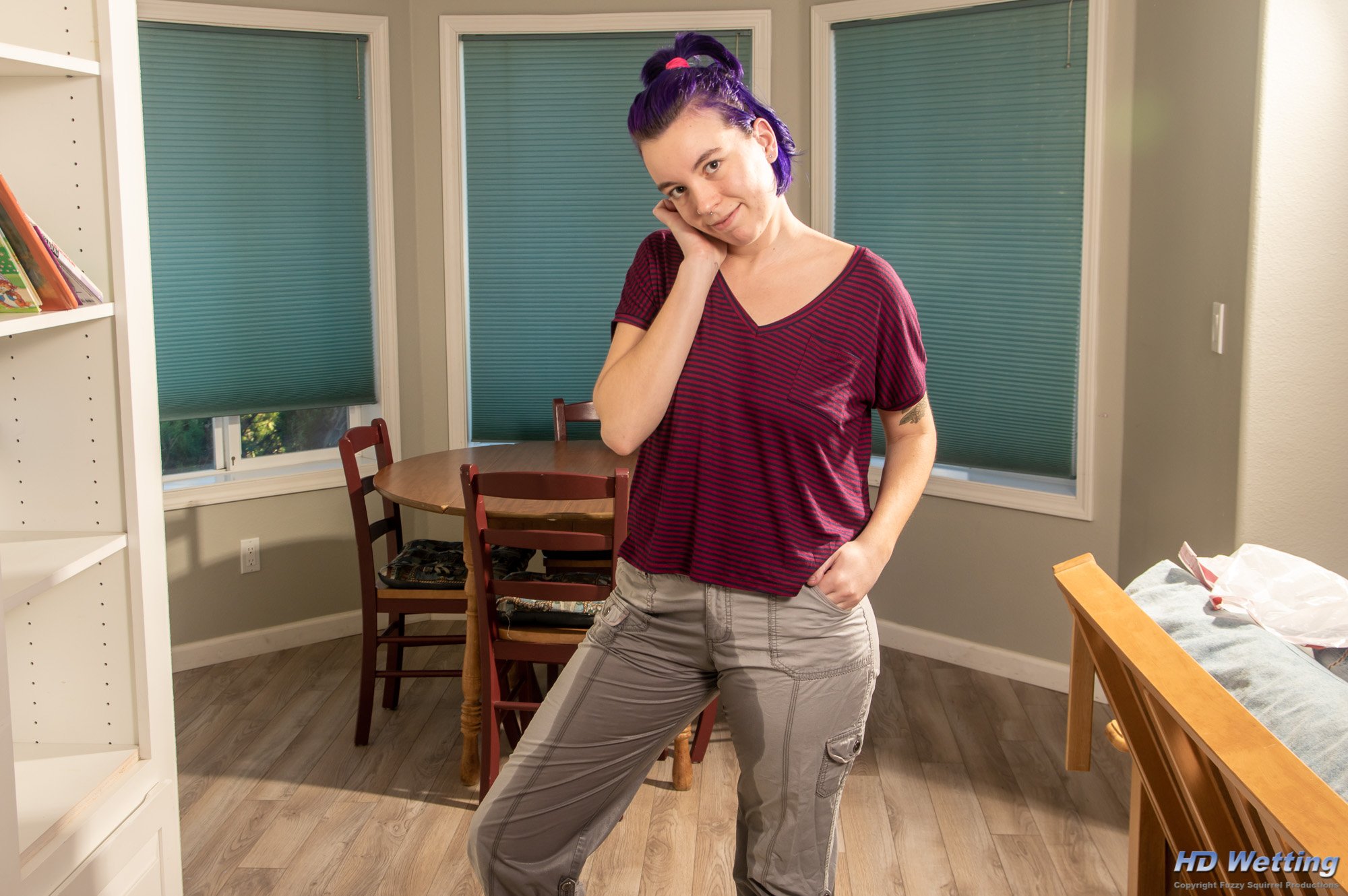 gallery_167 Wearing her soaked cargo pants, Olivia smiles at the camera.