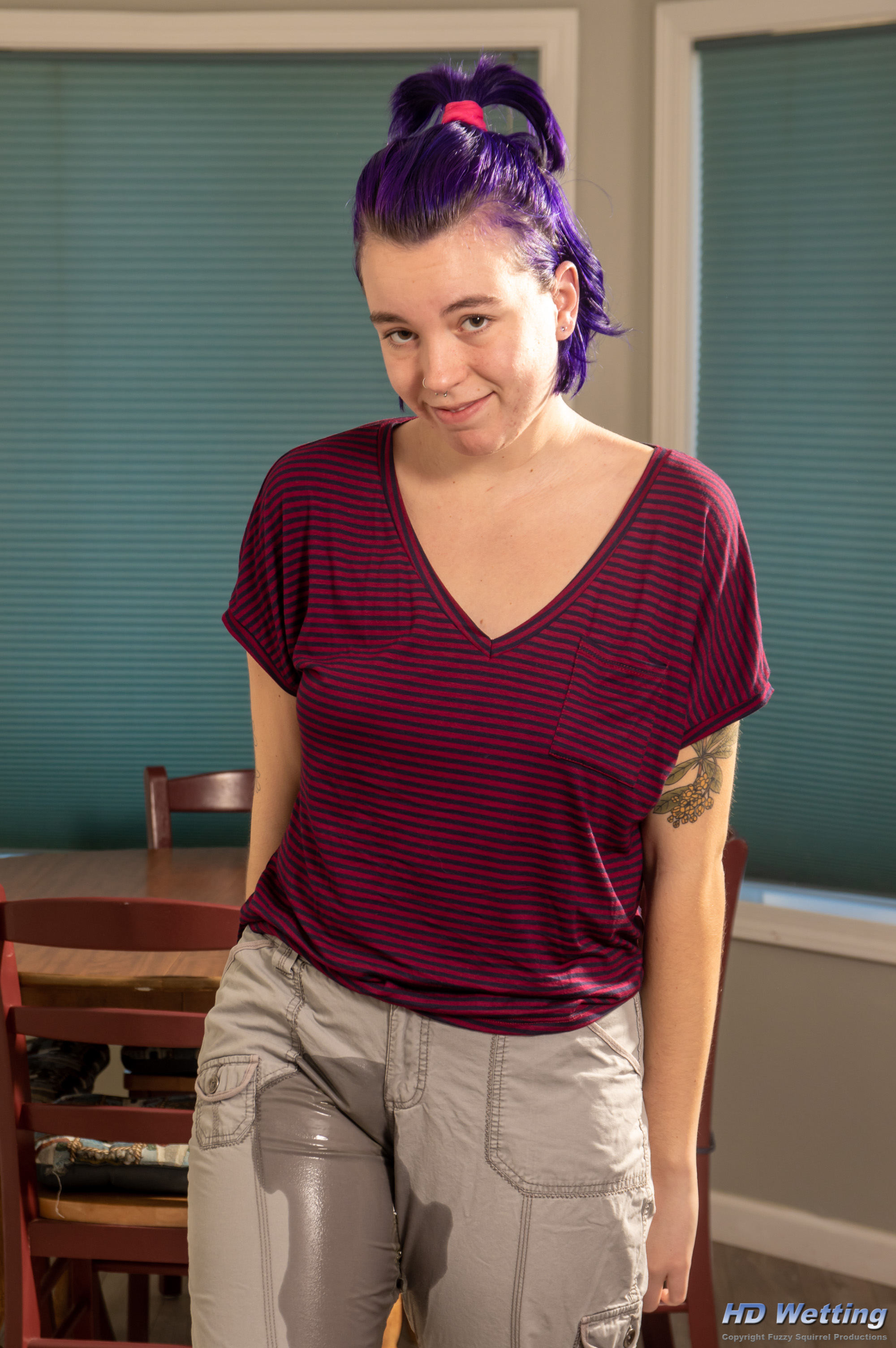 olivia-1317 Peeing in her cargo pants, Olivia looks a bit sheepish as she smiles at the camera.