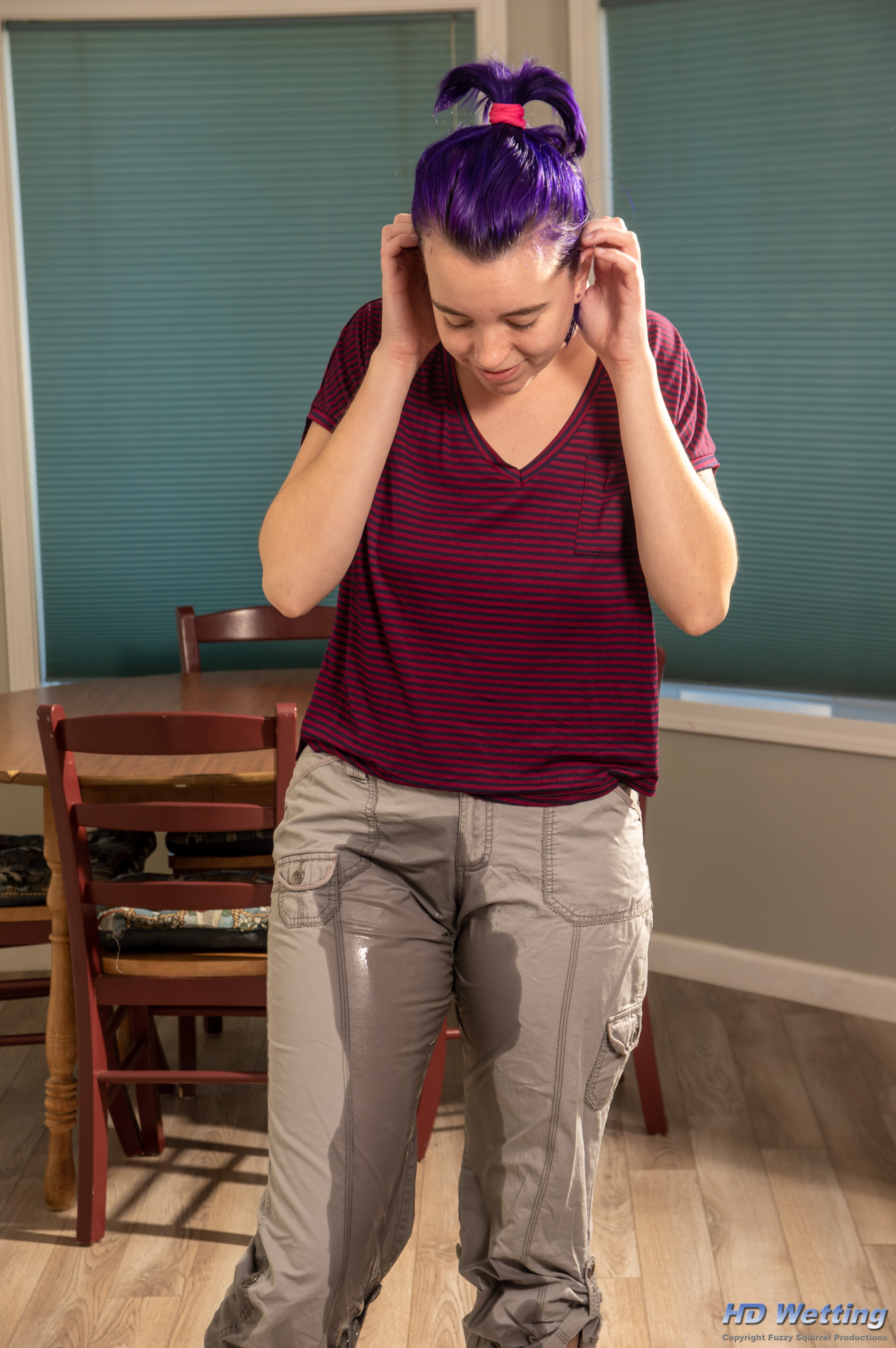 olivia-1328 Olivia looks down at the wet stain on her pants.
